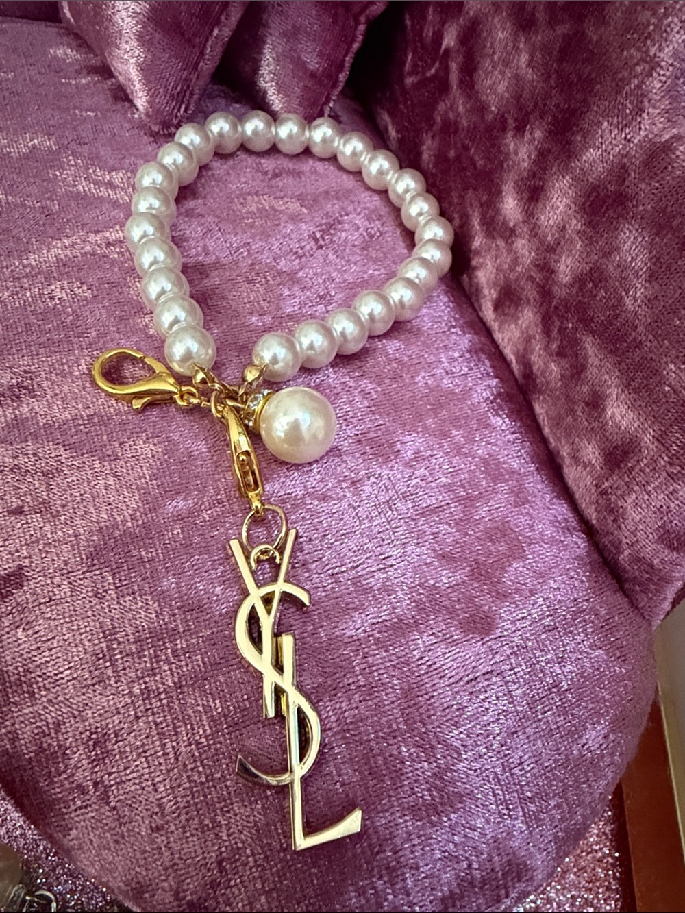 Unlisted White Pearl Beaded Charm cell phone Wristlet with Gold Logo Pendant